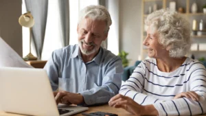 An older couple looking at their computer using one of the payment processing trends