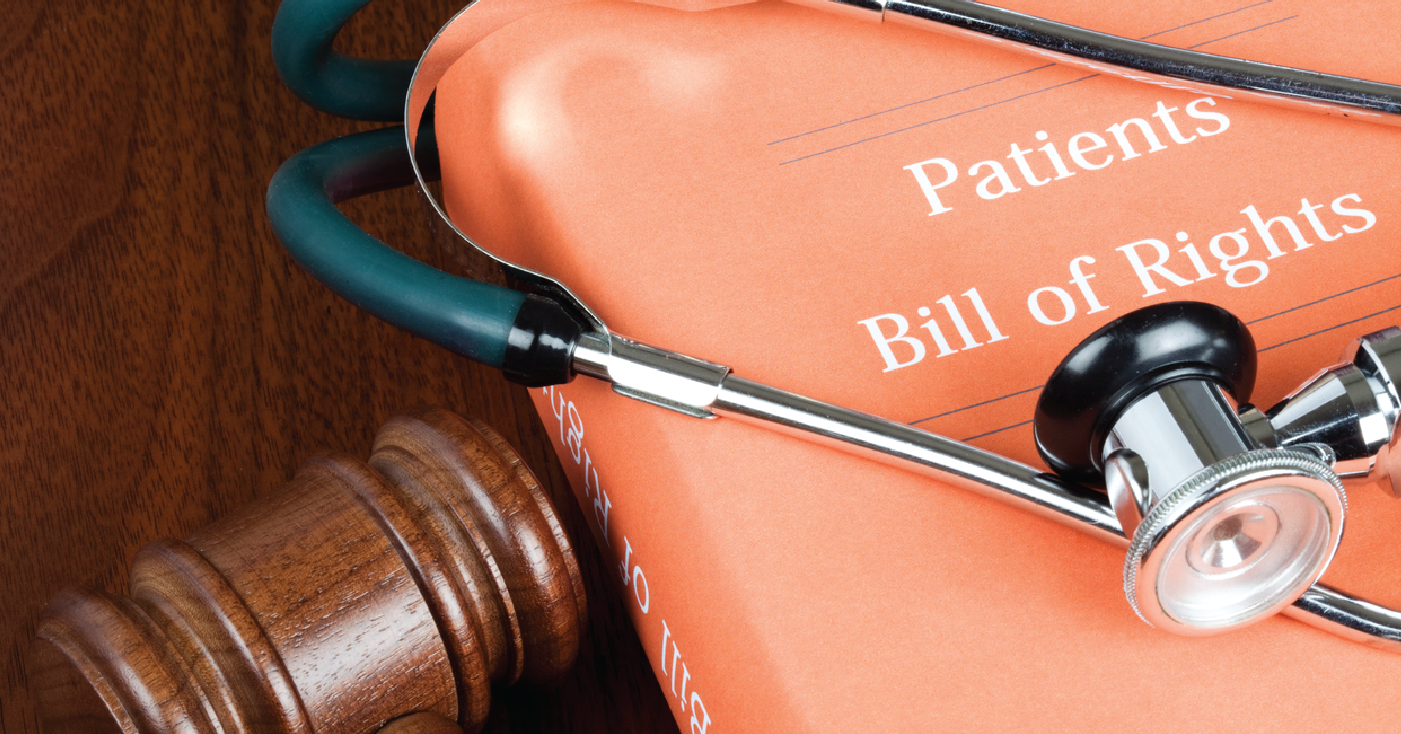 A book about the Patient Bill of Rights on a table with a judge’s gavel and doctor’s stethoscope.