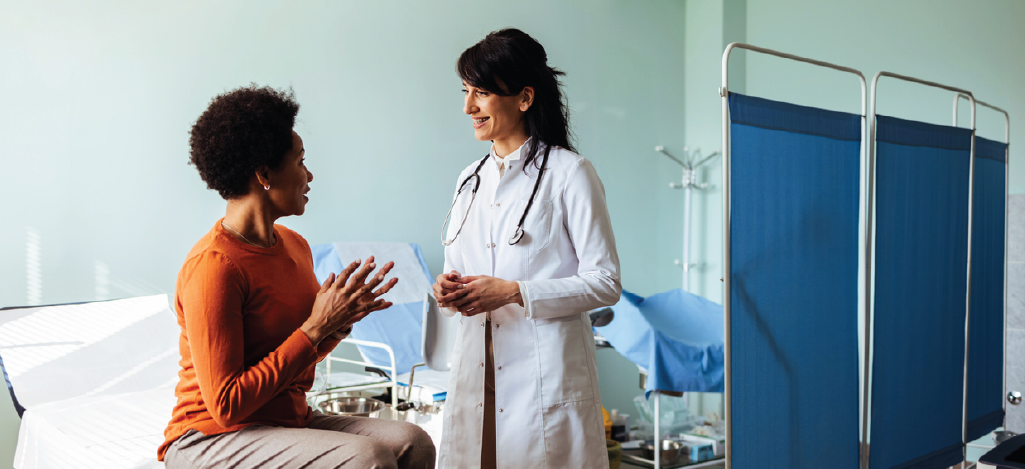 Female patient discussing preferred type of care with her female doctor.
