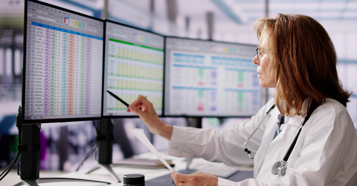 Medical Office Manager looking at the practice billing workflow process through a computer