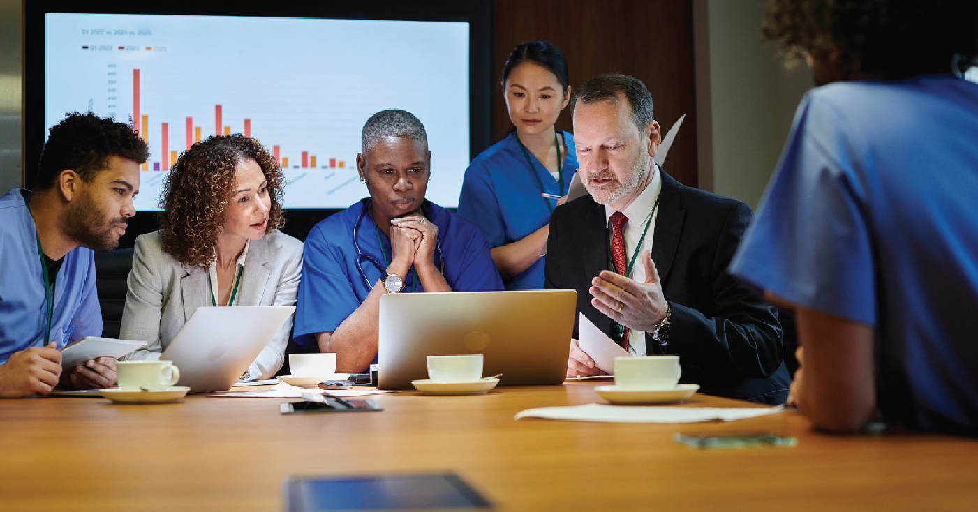 Integrating revenue integrity into healthcare operations - Healthcare professionals having a meeting in a conference room.