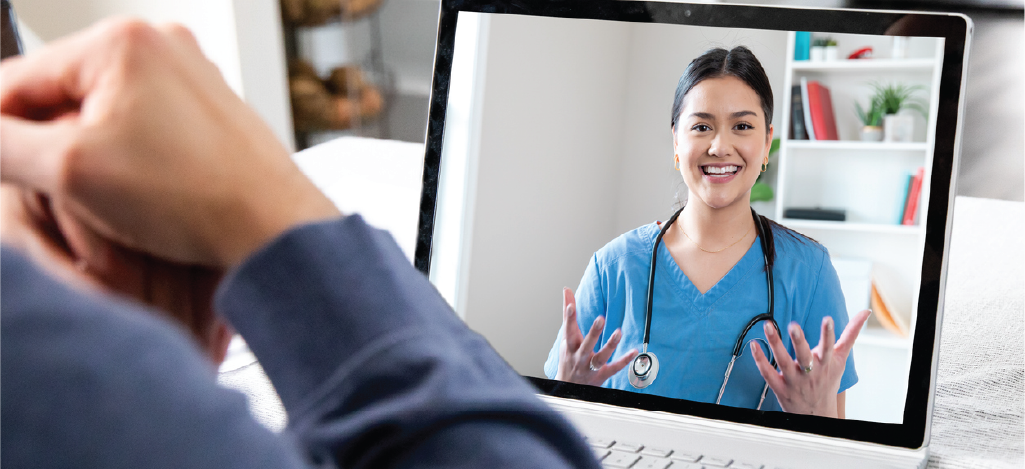 Male patient at home having a telemedicine appointment with his doctor.
