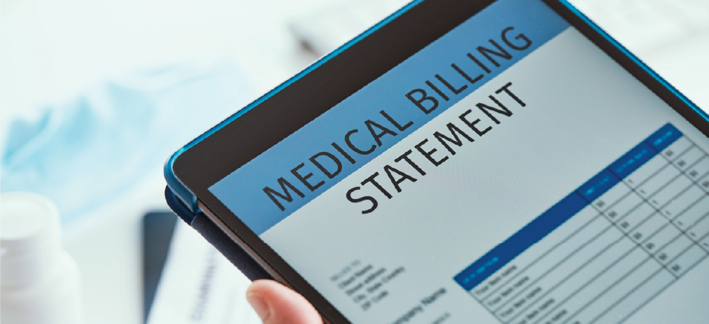 Sending patient billing reminders - Doctor holding a tablet device showing a patient’s medical billing statement.