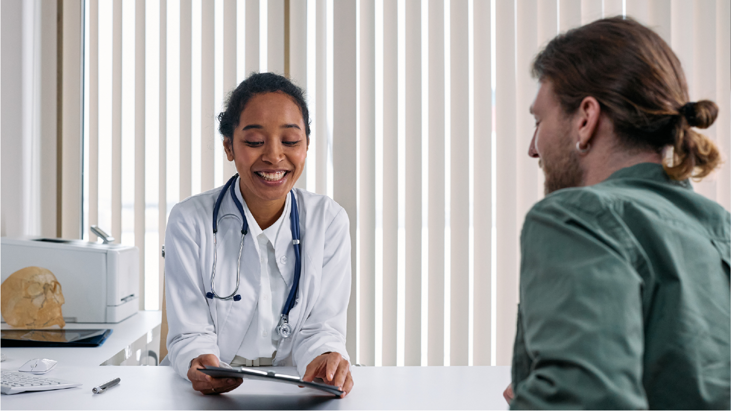 Doctor talking with patient about patient financing to prevent sticker shock