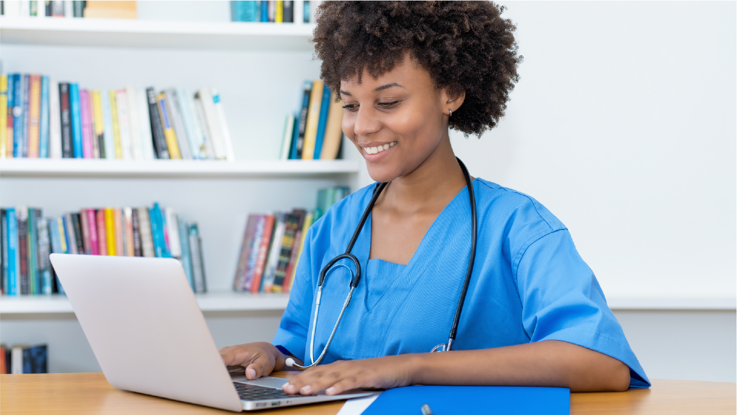 A nurse initiating the healthcare billing process, recording information on a computer