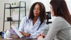 Doctor talking to patient about patient costs for the visit