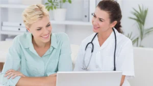 A doctor showing a patient the practice's payment ecosystem