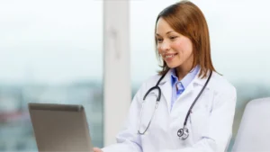 Doctor looking at computer