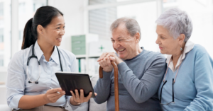 Doctor talking to an older couple about FlexPay