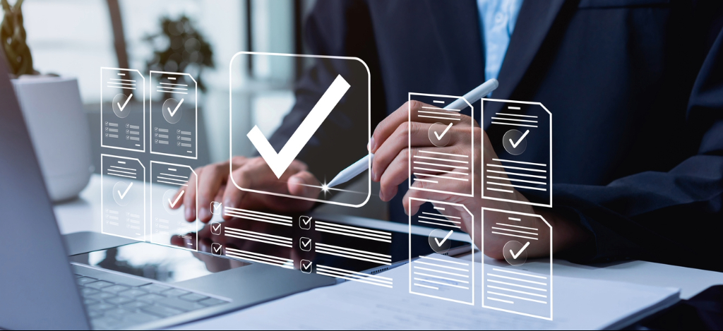 Cropped image of a manager using laptop and digital tablet in an office. Digital overlay shows automated workflow dashboards.