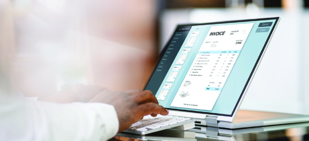 Strategies for effective patient communication - A male doctor using a computer to send medical invoices to patients.