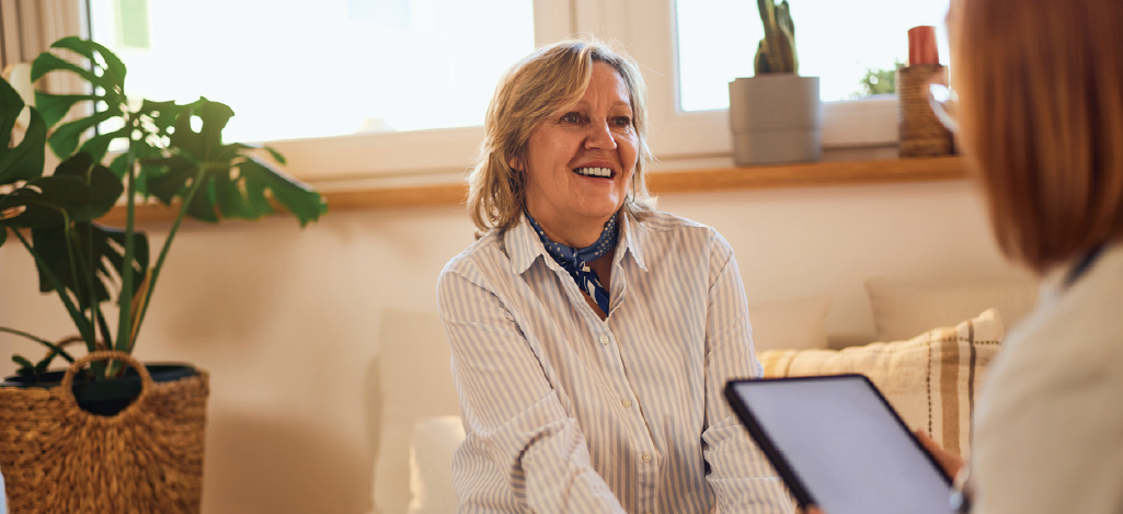  Mental health billing software must-haves - A female mental health professional discussing financing options with her female patient.