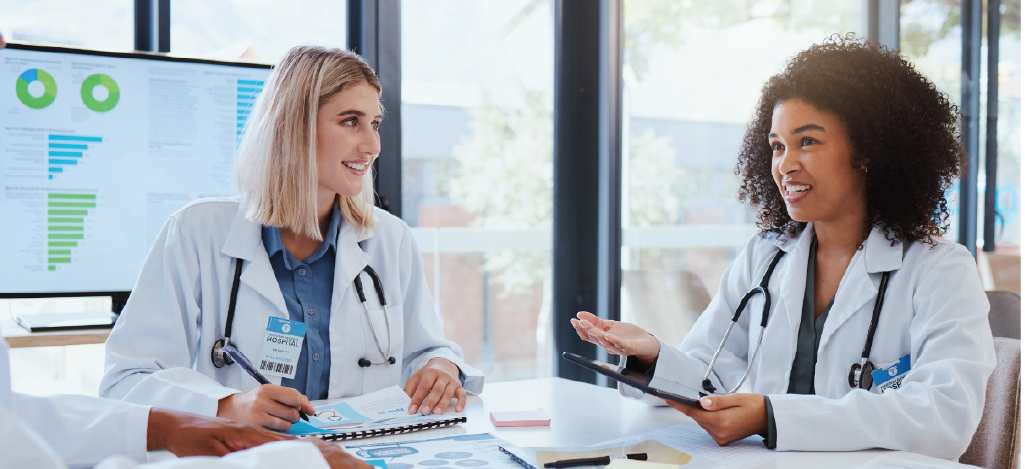 Optimizing revenue cycle - A group of doctors having a meeting about their practice’s revenue.