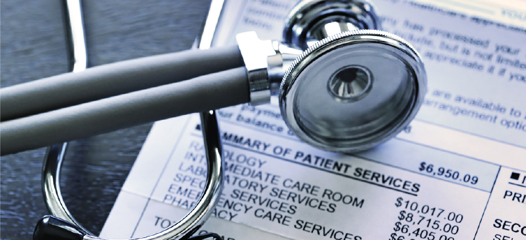 Common medical billing errors - A patient’s medical bill on a table with a doctor’s stethoscope.