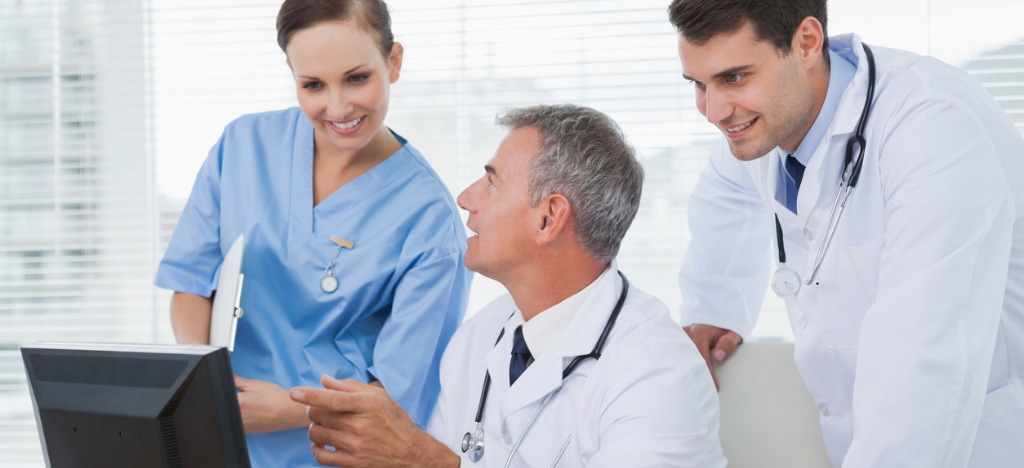 What is RCM - A group of medical professionals using a computer to implement administrative tasks.