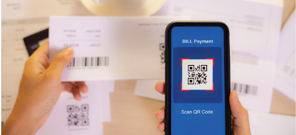 Streamlining telehealth billing - A person using a smartphone to scan a medical billing QR code.