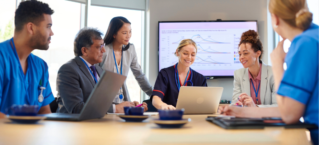 RCM outsourcing companies - A group of medical professionals having a meeting with their business partners.