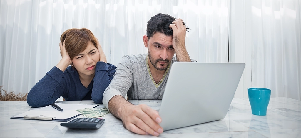 A couple who is frustrated because their doctor's medical billing software is outdated and doesn't allow them to pay their bill online.